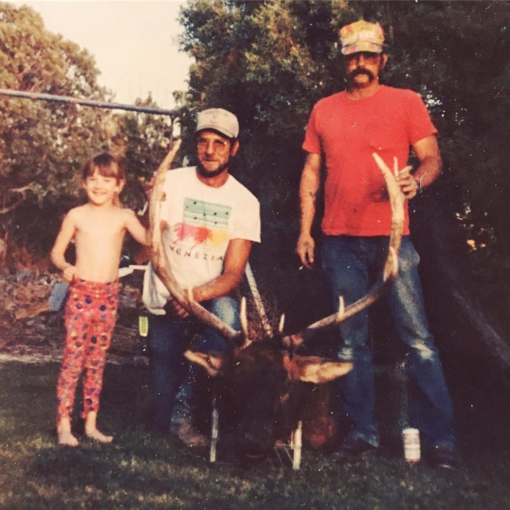 Young Alyse with her dad and his friend.